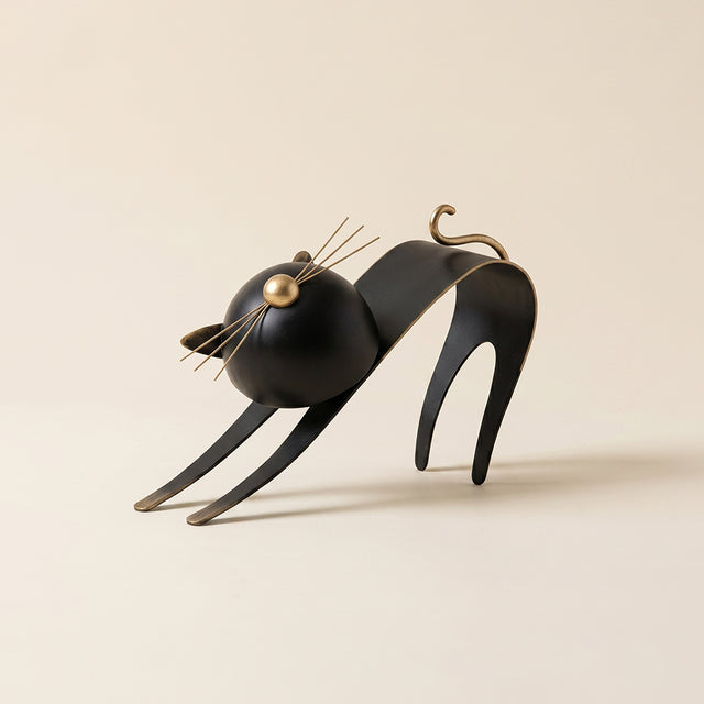 black cat sculpture stretching side view