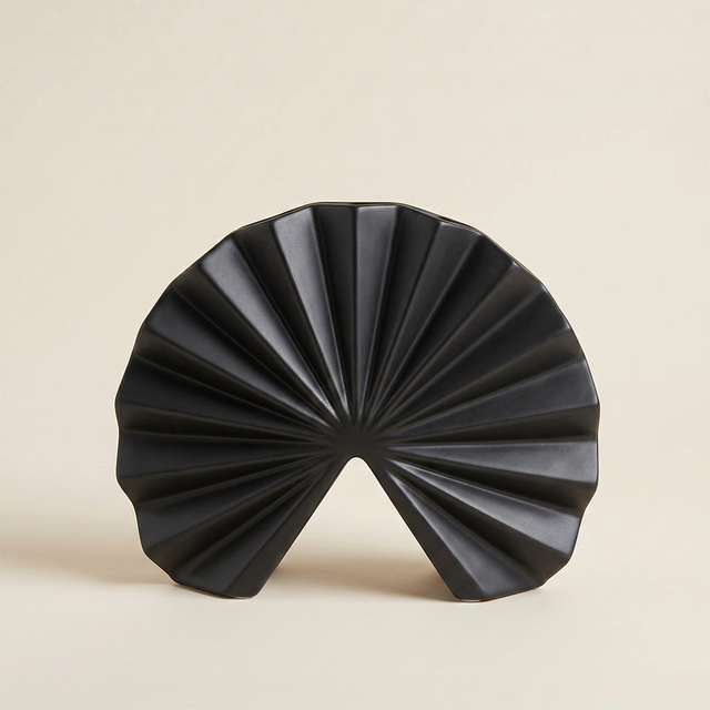 black fan pleated ceramic decor on beige