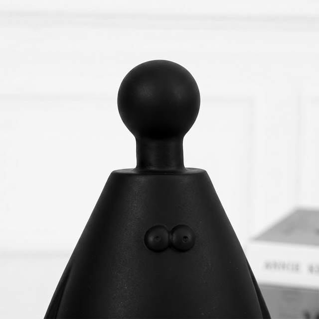 black figurine head close up