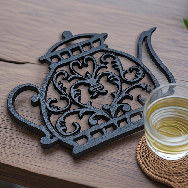 black table coaster beside a cup of tea