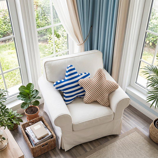 blue and brown starfish pillows on white armchair