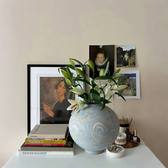 blue ceramic flower vase on the table