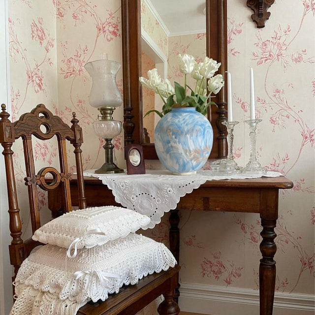 blue ceramic flower vase on the wooden table
