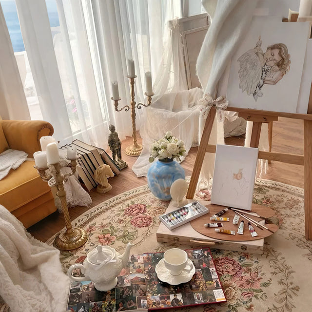 blue ceramic flower vase with flower arrangement on the floor