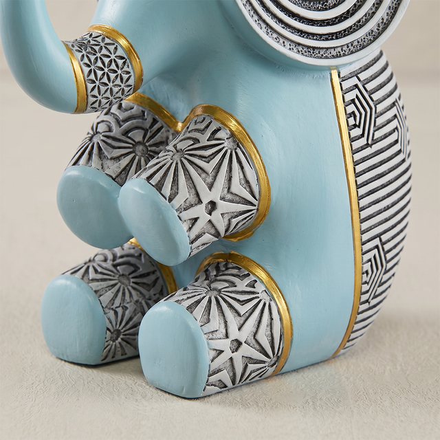 blue resin elephant patterned legs close up