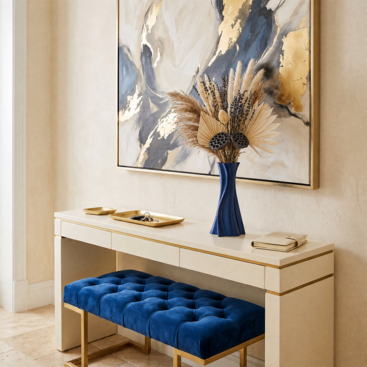 blue twisted vase with dried palm on white console