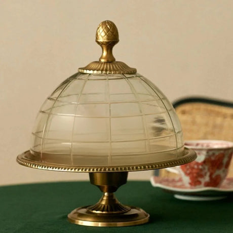 brass cake stand on the table