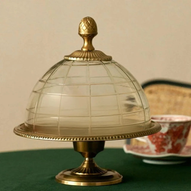 brass cake stand on the table