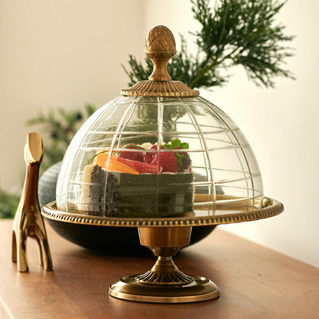 brass cake stand on the table