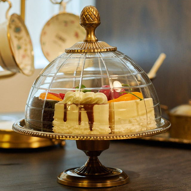 brass cake stand on the table