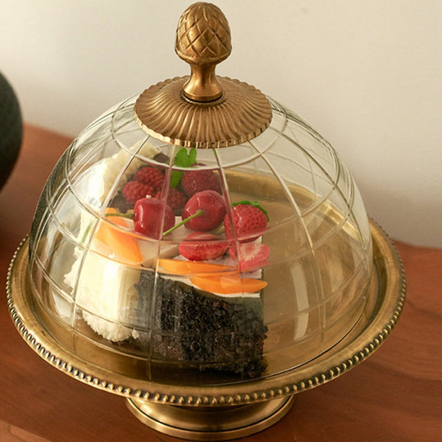 brass cake stand on the table