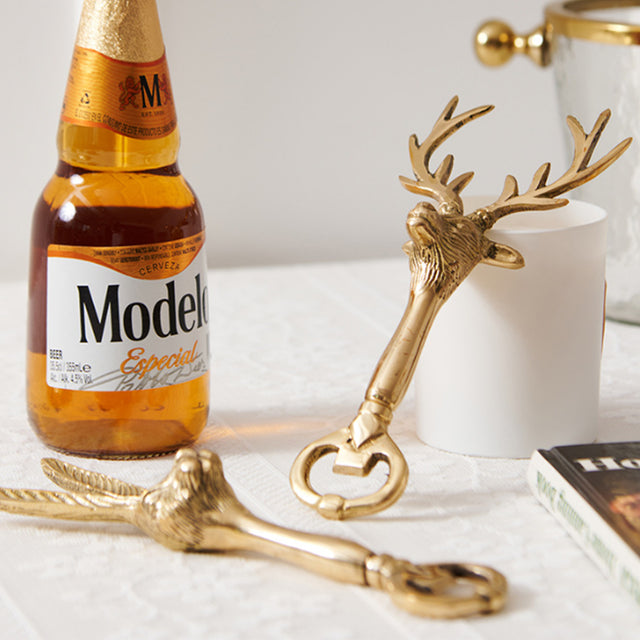 brass decorative bottle opener near the wine