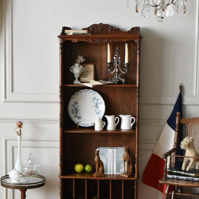 brown cat bookend in the cabinet