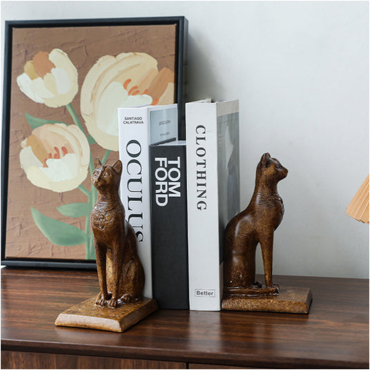 brown cat bookend on the table