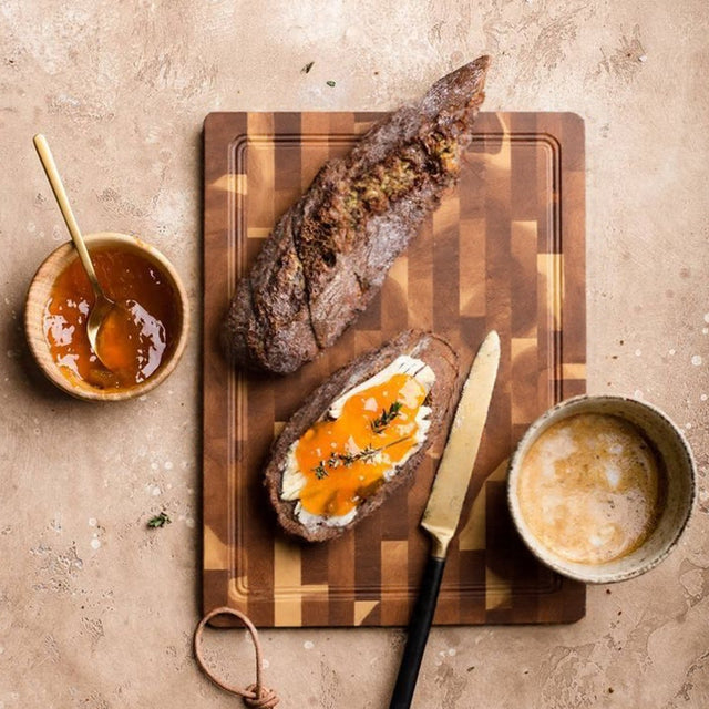 brown cutting board serving steak