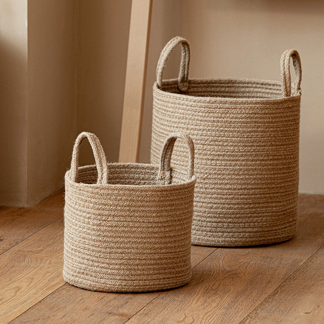 brown laundry bakset on the floor