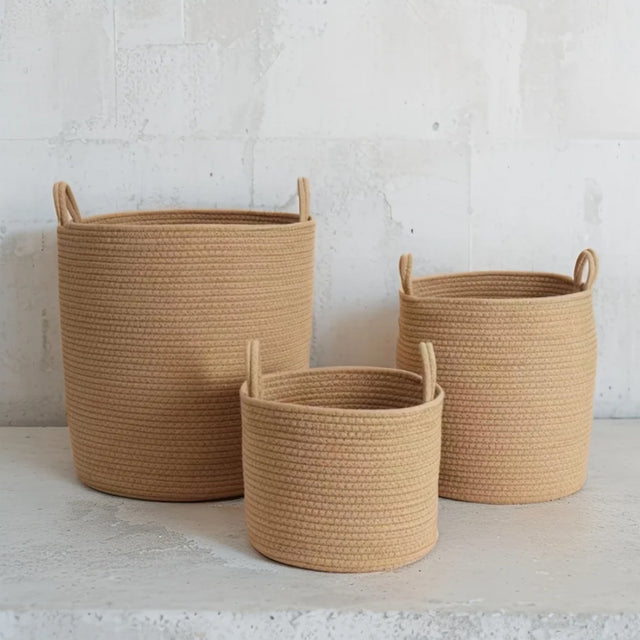 brown laundry bakset set on the floor