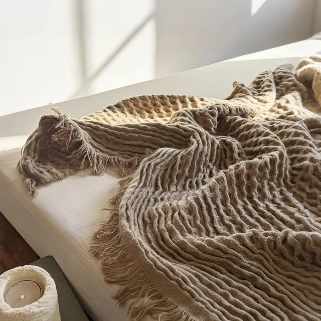 brown throw blanket on bed