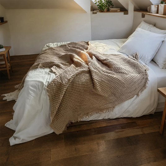 brown throw blanket on bed