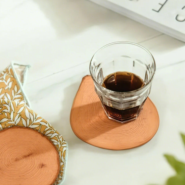 brown wood coaster used for cup mat