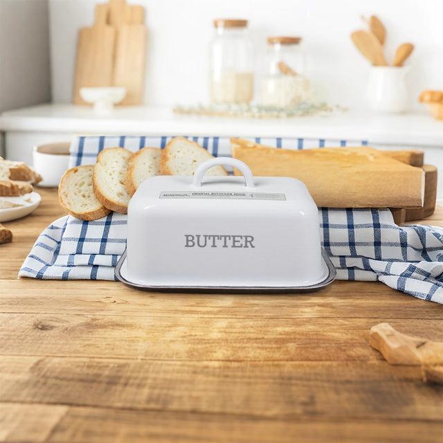 butter dish with lid on the wooden dining table