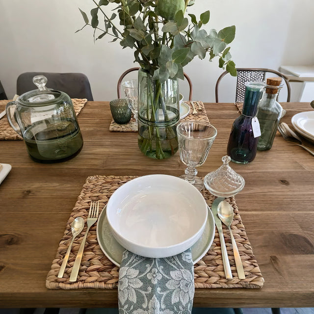 cake plate with conical lid on the wooden dining table