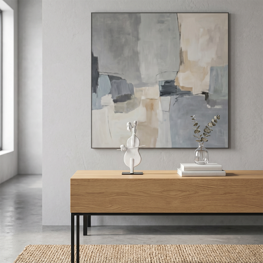 cello sculpture on wooden console under painting