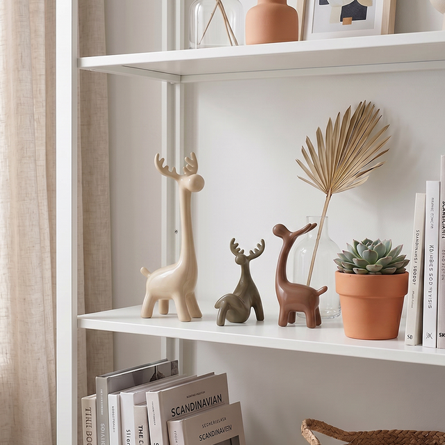 ceramic deer display white bookshelf