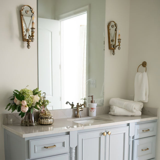 ceramic dispenser bottle on the blue washbasin