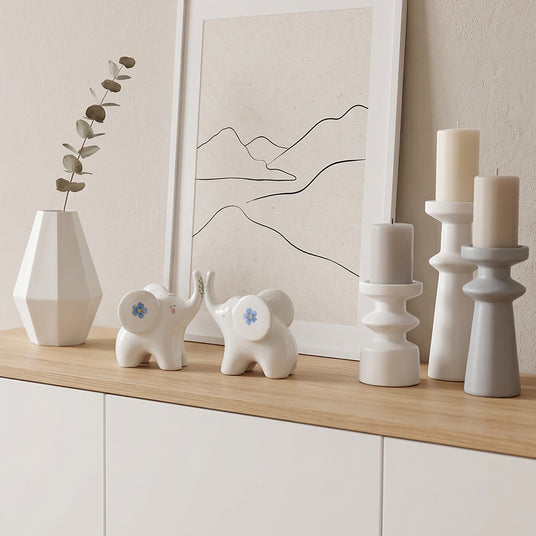 ceramic elephants on wooden cabinet top