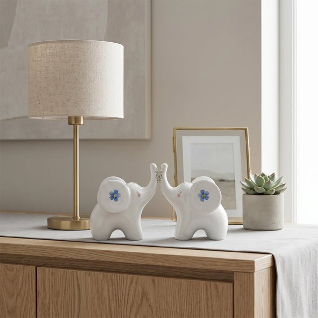 ceramic elephants on wooden sideboard