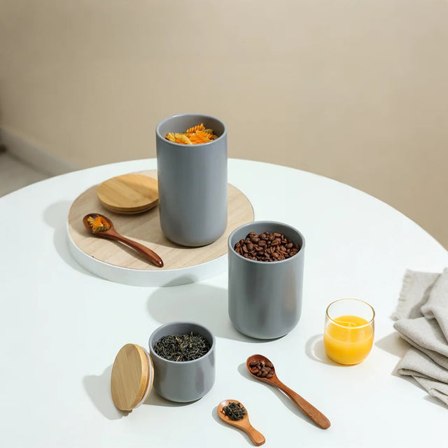 ceramic storage jar set with spoons gray on the table
