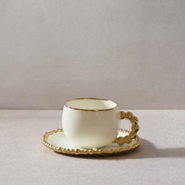 ceramic tableware with golden pearl trimmed edge cup and tray