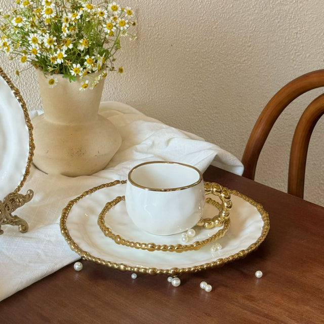 ceramic tableware with golden pearl trimmed edge details