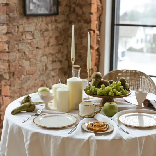 ceramic tableware with golden pearl trimmed edge on the dining table
