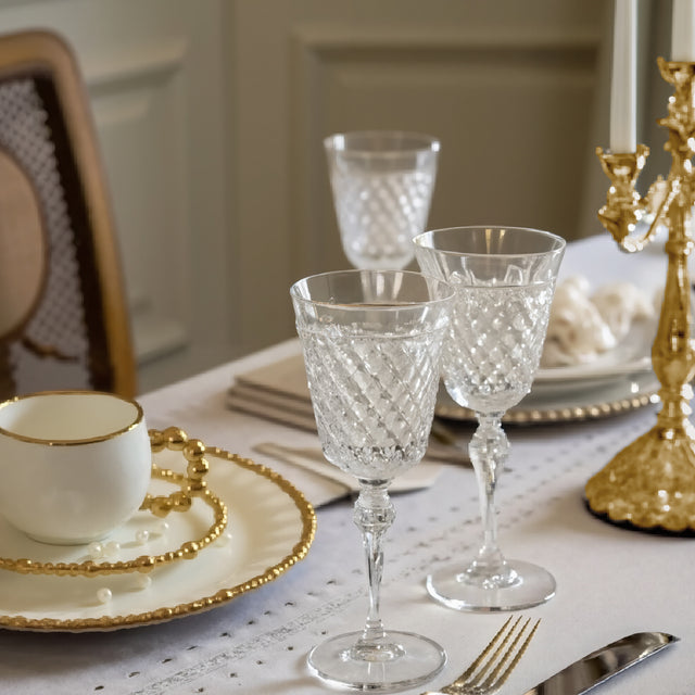 ceramic tableware with golden pearl trimmed edge on the dining table