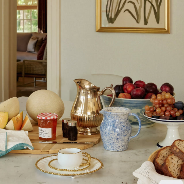 ceramic tableware with golden pearl trimmed edge on the table