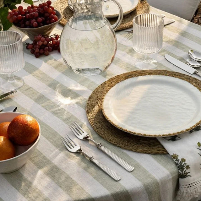 ceramic tableware with golden pearl trimmed edge on the table