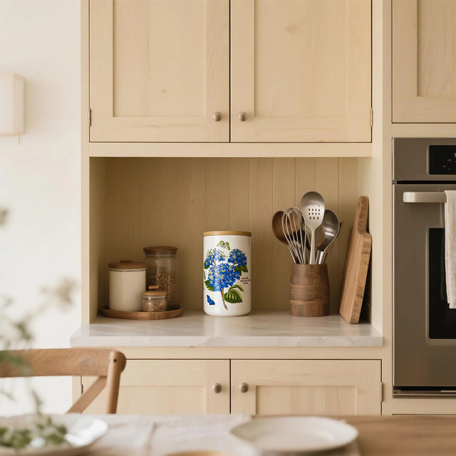 ceramic white cylinder storage jar with a wooden lid in the cabinet