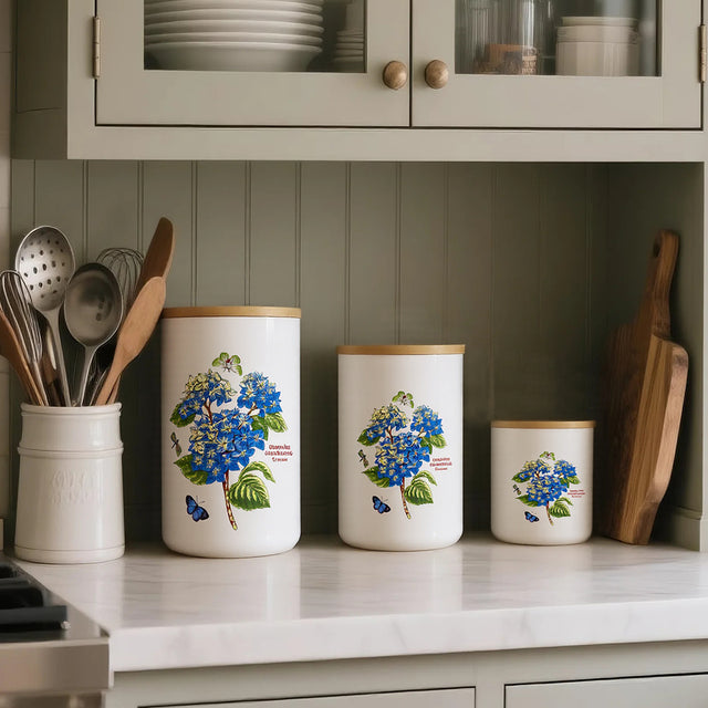ceramic white cylinder storage jar with a wooden lid in the kitchen