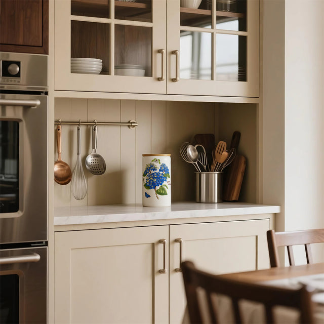 ceramic white cylinder storage jar with a wooden lid in the kitchen