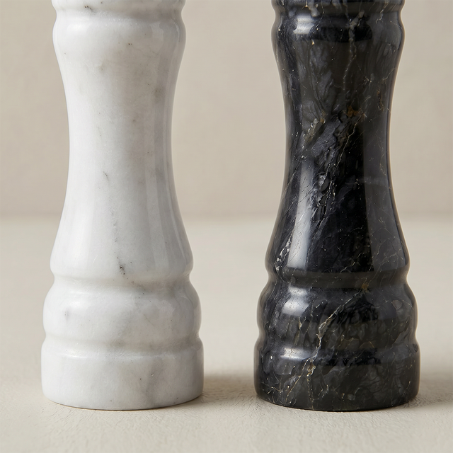 close up of black and white marble mill bases