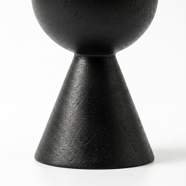 close up of black conical candle holder base