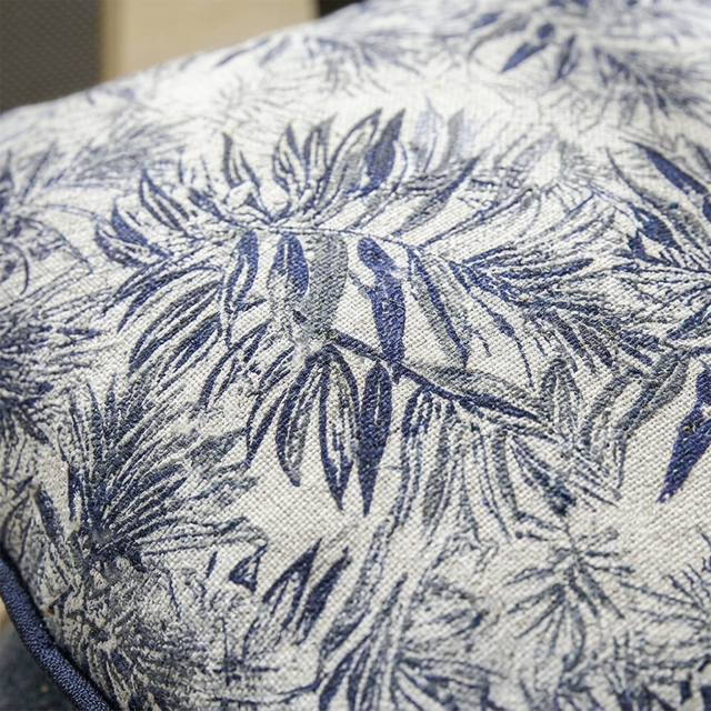 close up of blue palm leaf jacquard fabric texture