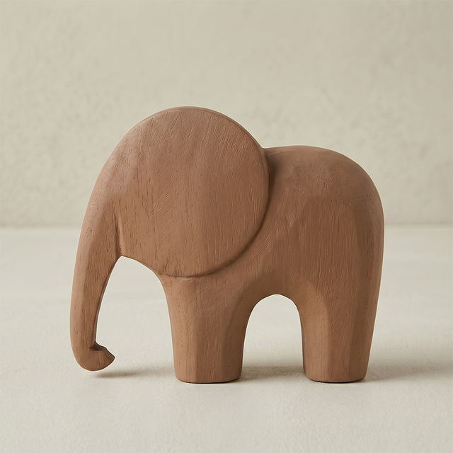 close up of brown wooden elephant figurine