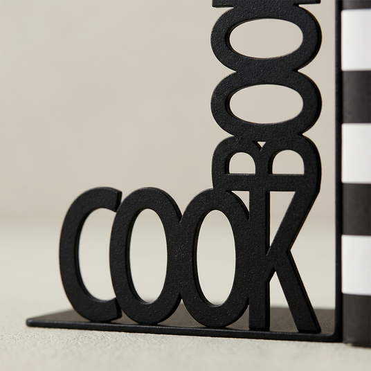 close up of cookbook text metal bookend