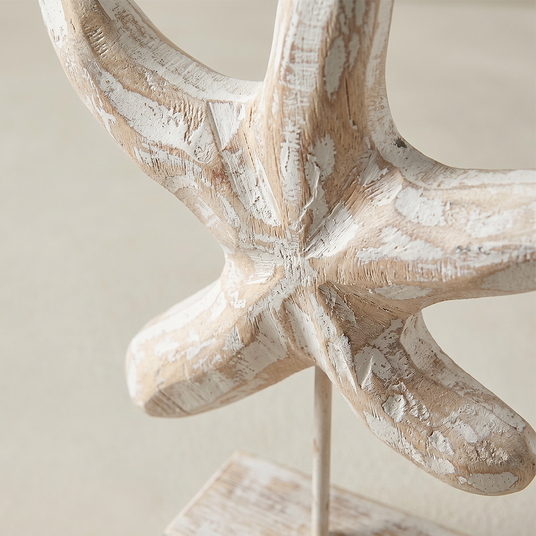 close up of distressed wood starfish figurine