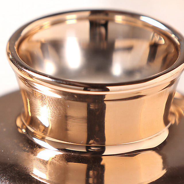 close up of glass vase opening and metallic rim