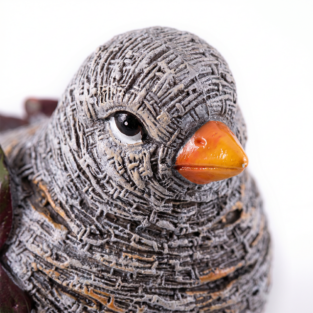 close up of leaf bird sculpture face and beak