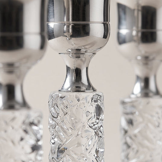 close up of silver candle holder top and crystal